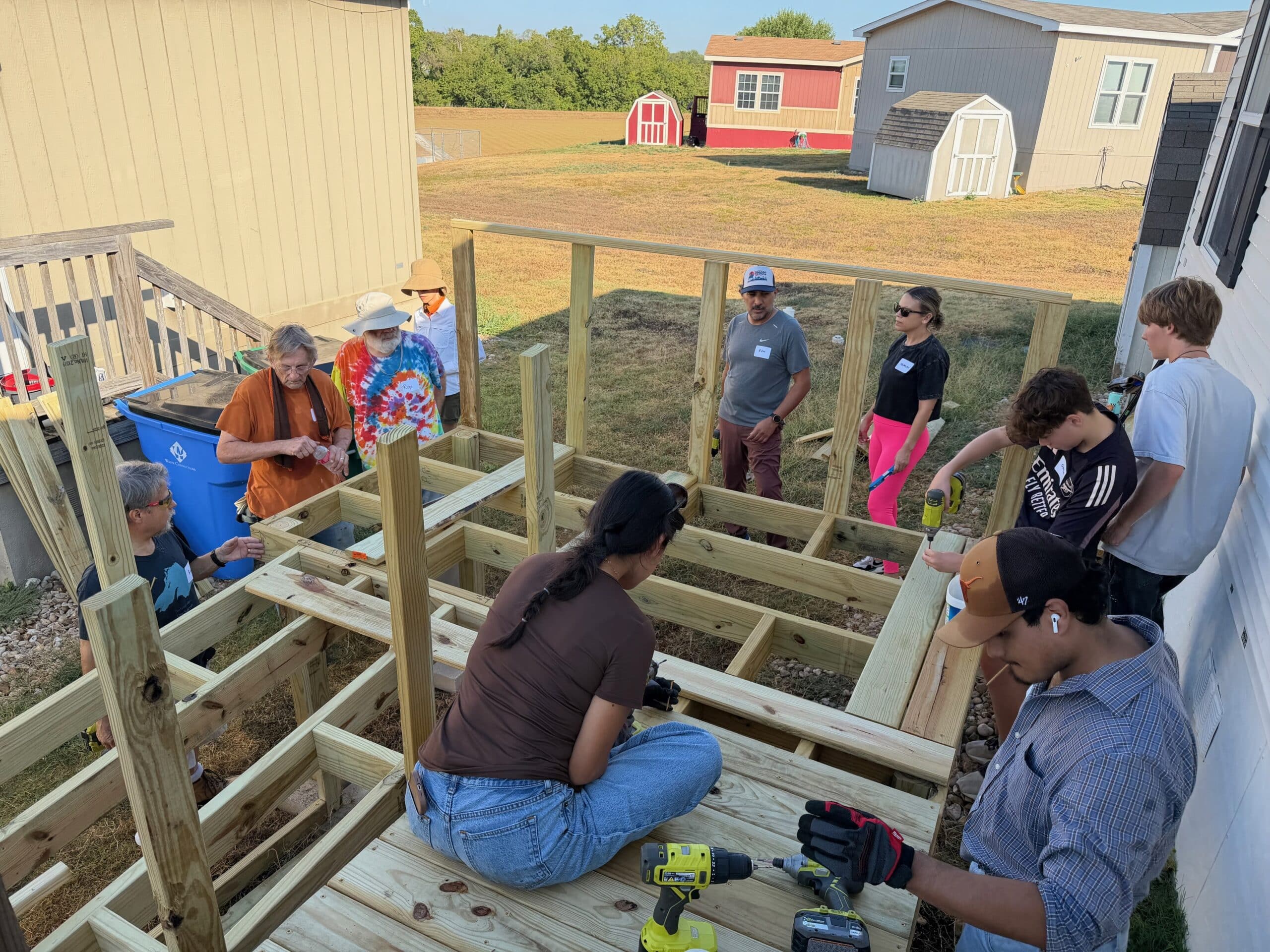 People building the top section of a ramp.