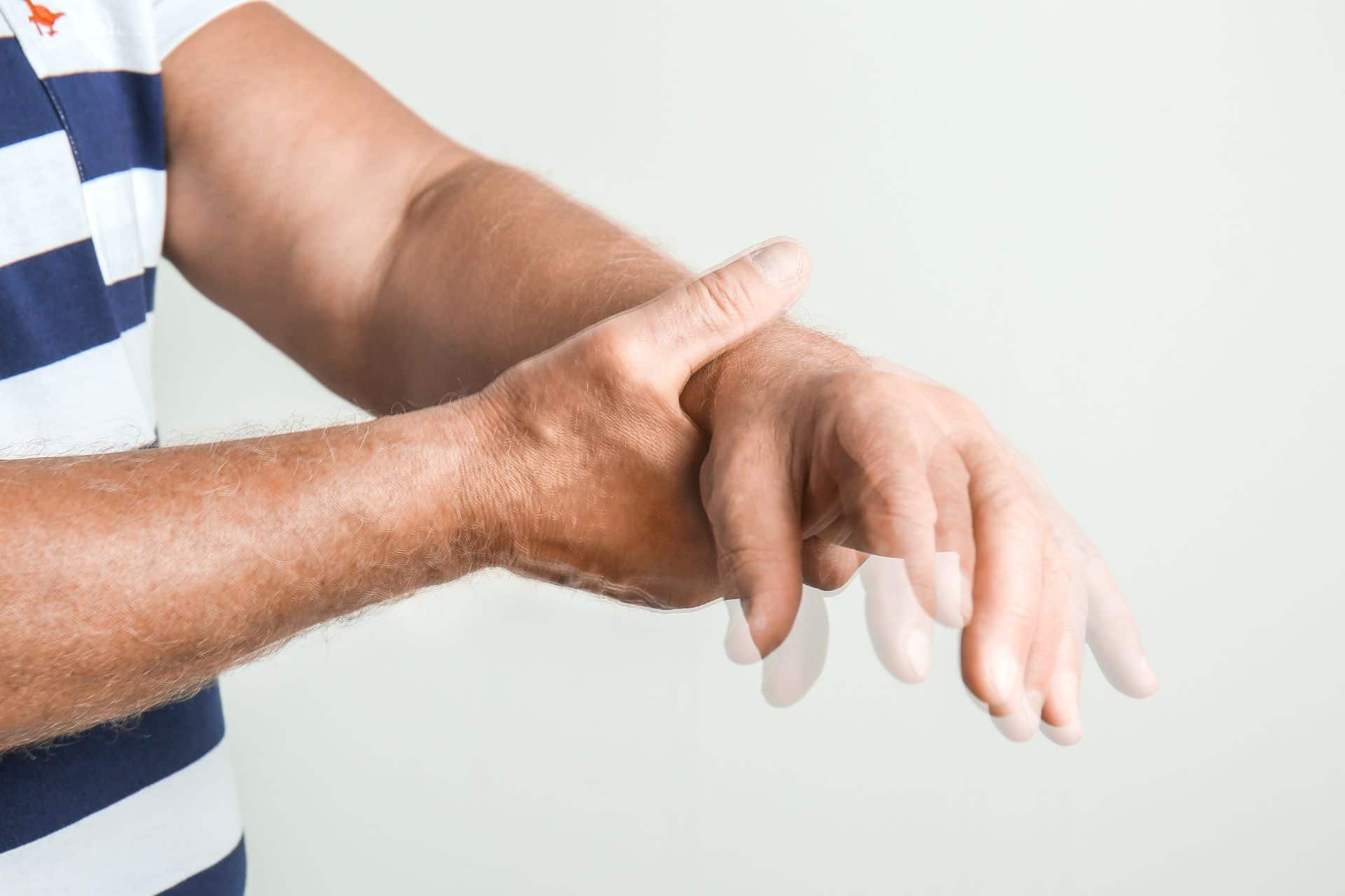 person's hands as they experience dyskinesias